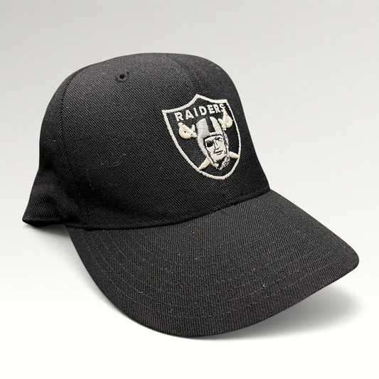 Raree Finds vintage black Oakland Raiders Reebok fitted hat with silver embroidered shield logo on wool blend fabric
