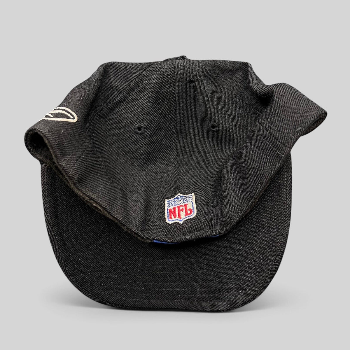 Raree Finds vintage Reebok Oakland Raiders black wool fitted hat with NFL shield embroidery on the back