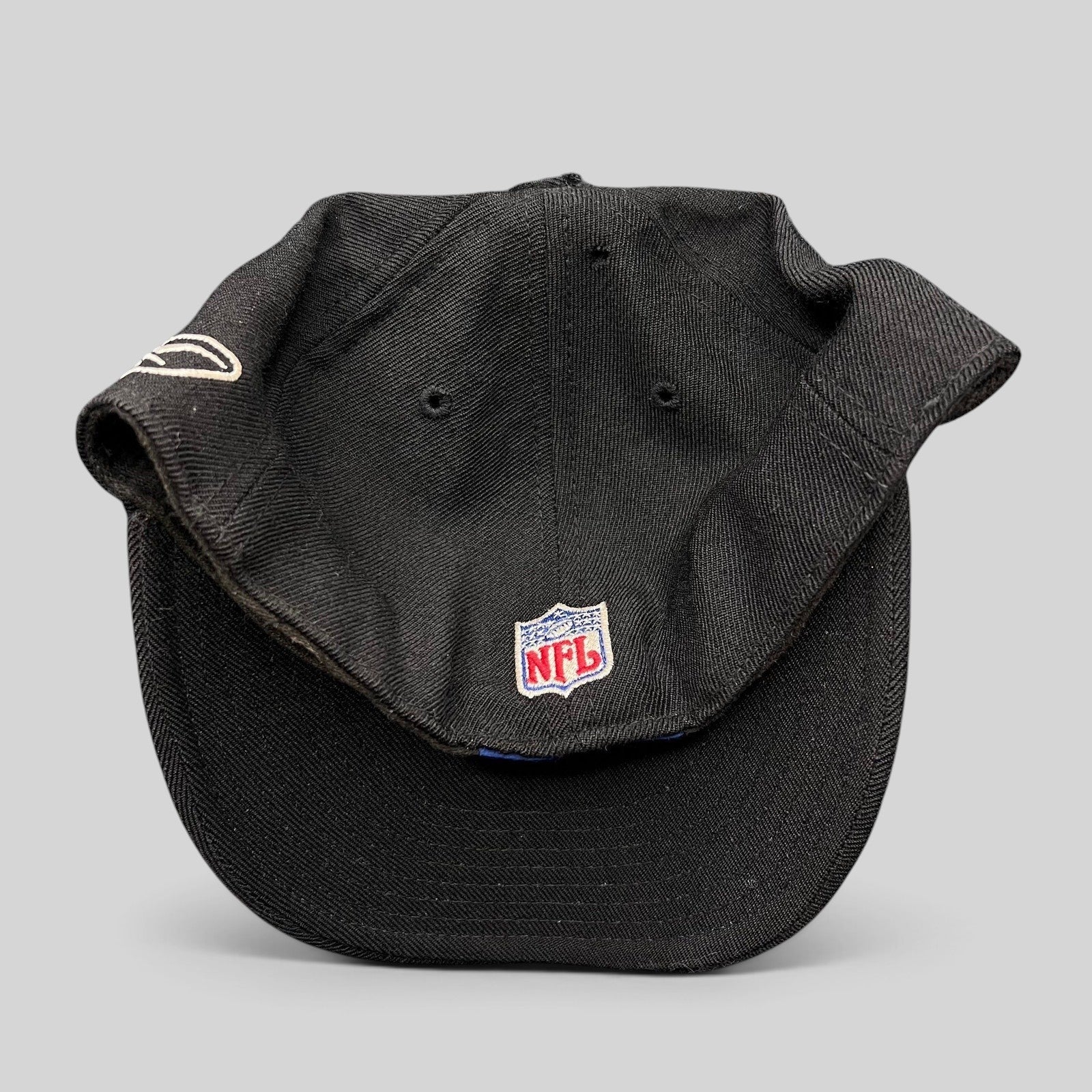 Raree Finds vintage Reebok Oakland Raiders black wool fitted hat with NFL shield embroidery on the back