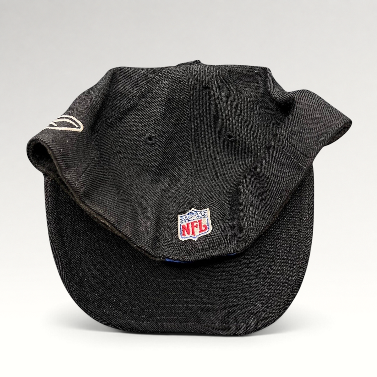 Raree Finds vintage Reebok Oakland Raiders black wool fitted hat with NFL shield embroidery on the back