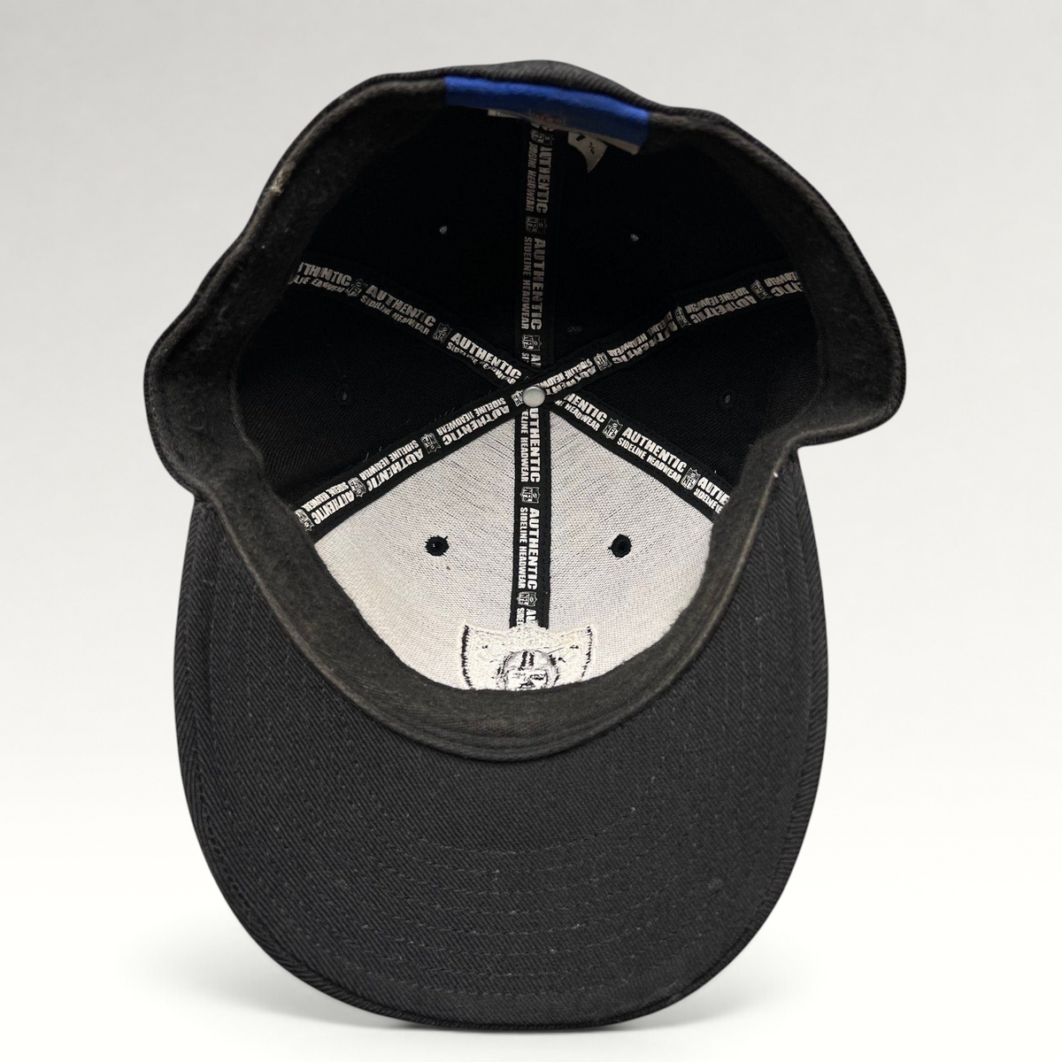 Raree Finds vintage Oakland Raiders Reebok fitted hat interior showing authentic NFL sideline branding and labels