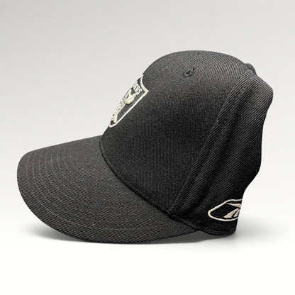 Raree Finds vintage Reebok Oakland Raiders black wool blend fitted hat with silver shield logo and side embroidery