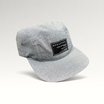 Raree Finds Oakley light denim chambray 5-panel camp cap with black Science Wrapped in Art patch and metal buckle