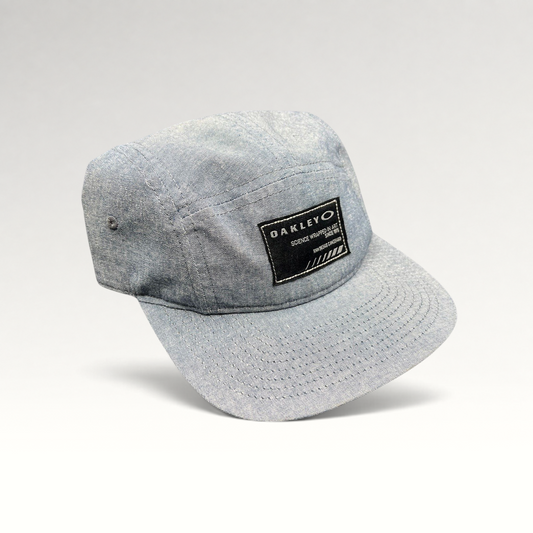 Raree Finds Oakley light denim chambray 5-panel camp cap with black Science Wrapped in Art patch and metal buckle