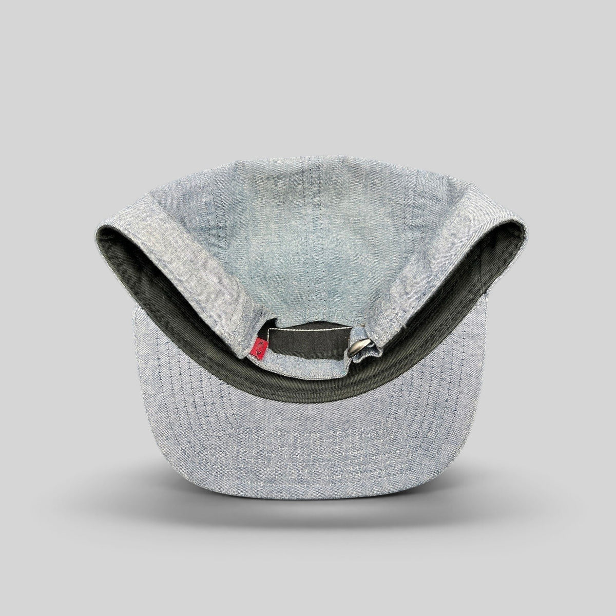 Raree Finds Oakley light denim chambray 5-panel camp cap interior view with adjustable metal buckle strap