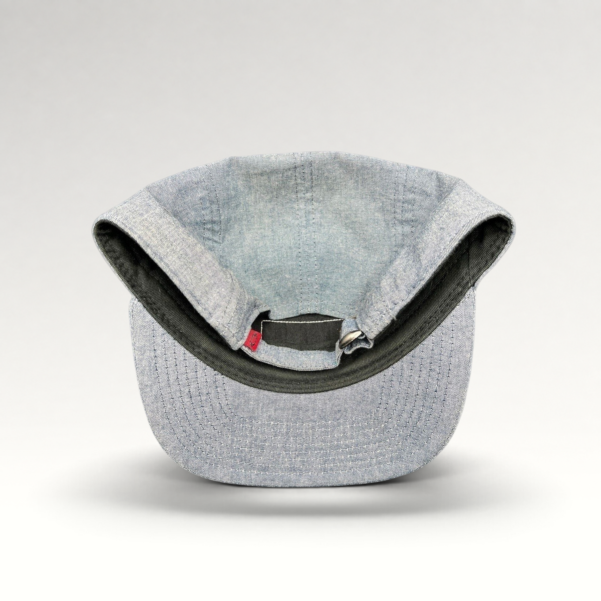 Raree Finds Oakley light denim chambray 5-panel camp cap interior view with adjustable metal buckle strap