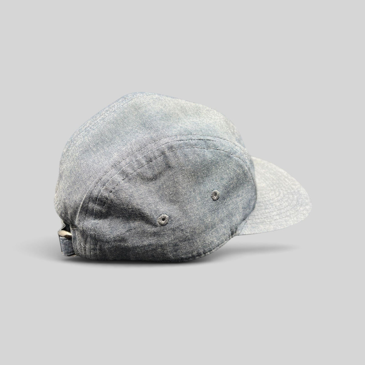 Raree Finds Oakley light denim chambray 5-panel camp cap with metal buckle strap, side view.