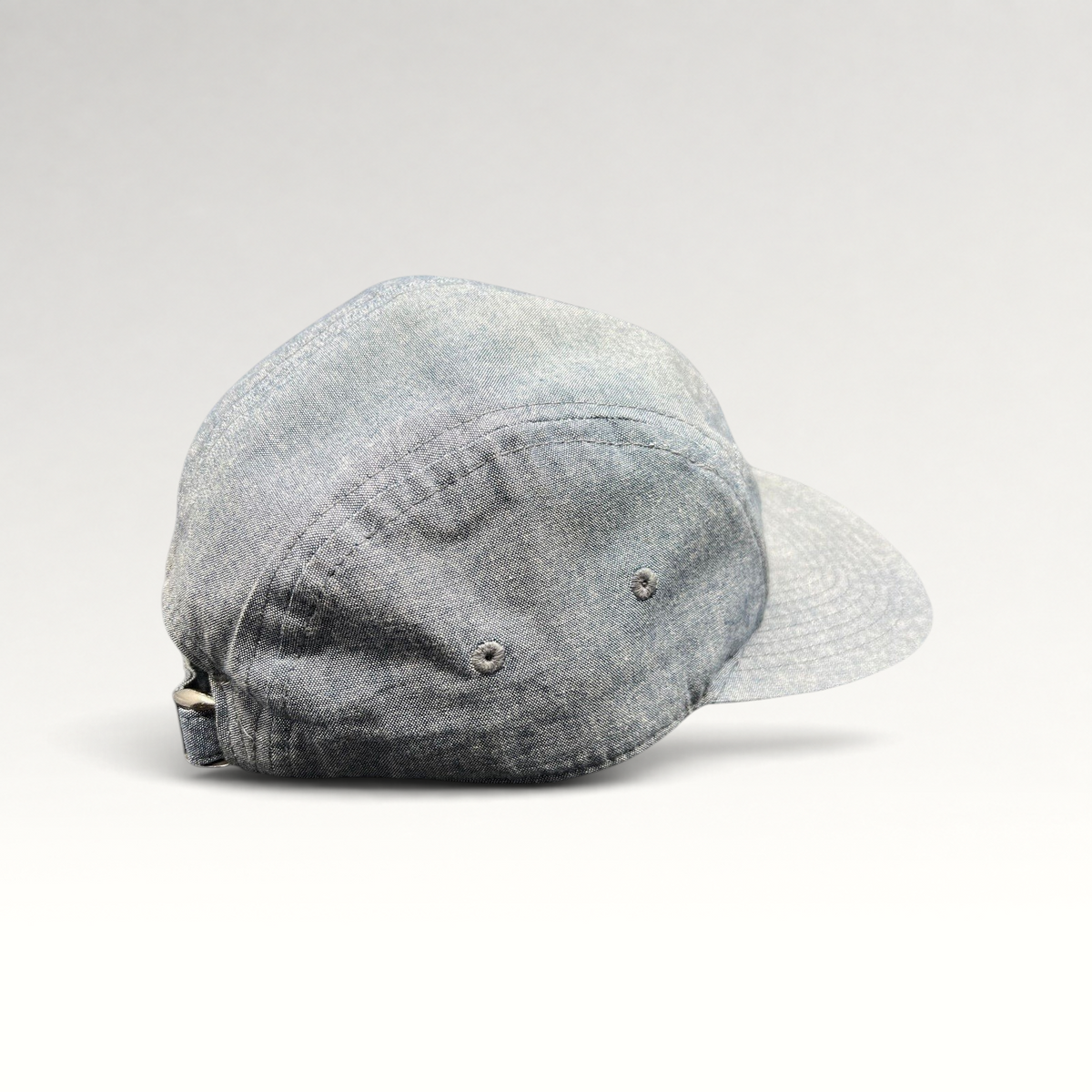 Raree Finds Oakley light denim chambray 5-panel camp cap with metal buckle strap, side view.