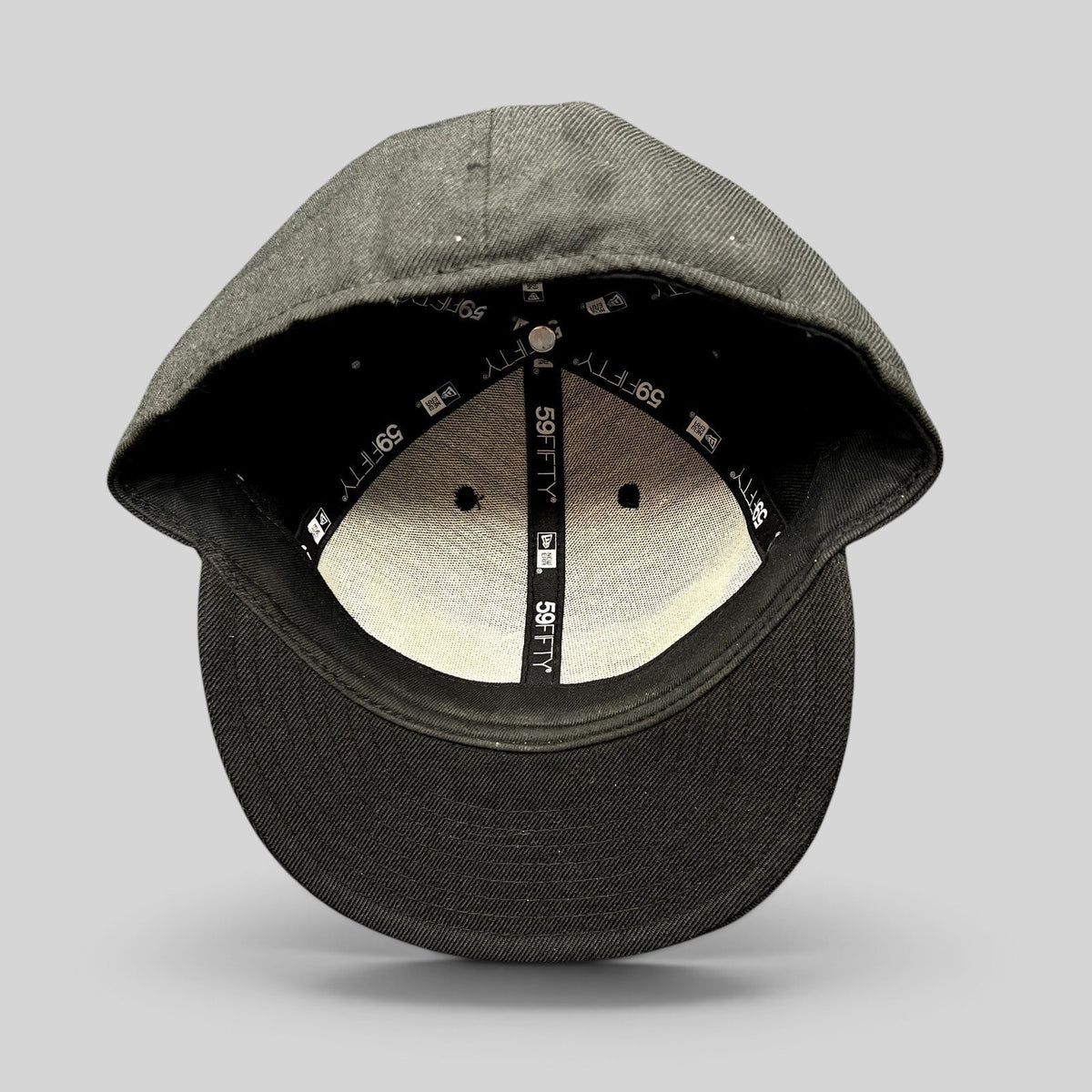 Raree Finds Oakley New Era 59FIFTY fitted hat interior view showing branded taping and structured black crown