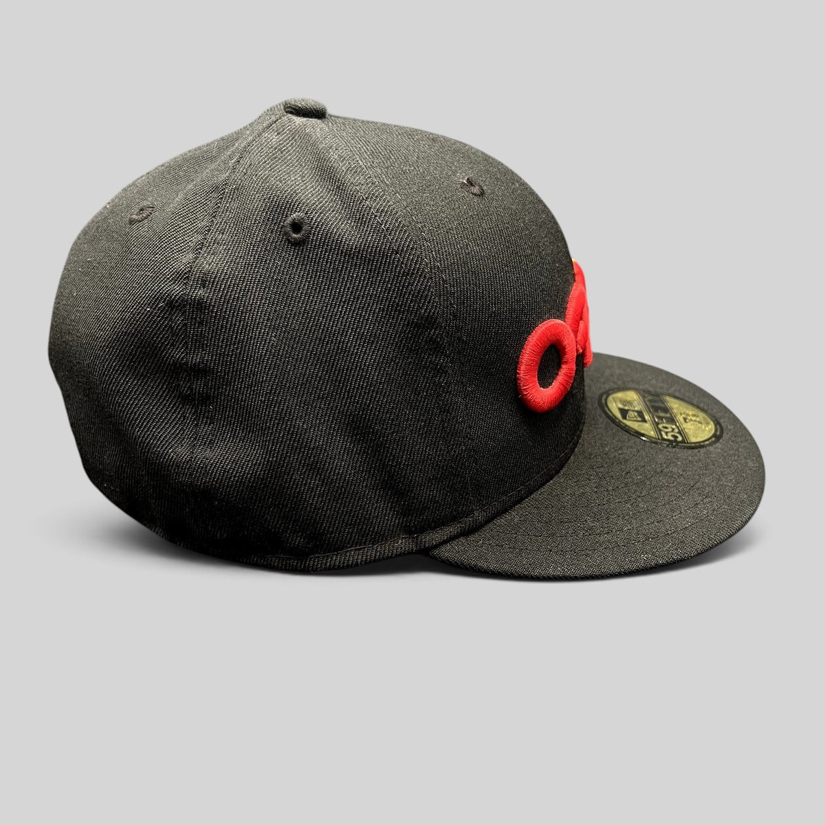 Raree Finds black Oakley New Era 59FIFTY fitted hat with a raised red and gold 3D embroidered logo and flat bill.