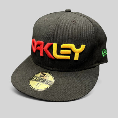 Raree Finds Oakley New Era 59FIFTY fitted hat in black with a raised 3D red and gold embroidered logo and flat bill.
