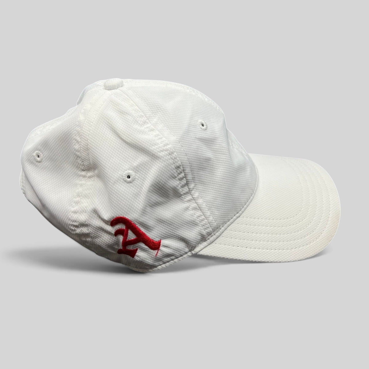 Raree Finds Oakley Hydrolix white performance cap with red embroidered logo and moisture-wicking polyester fabric
