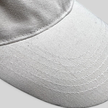 Raree Finds off-white cotton strapback hat with detailed stitching on the curved brim from Land of the Lost movie