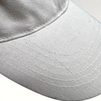 Raree Finds off-white cotton strapback hat with detailed stitching on the curved brim from Land of the Lost movie
