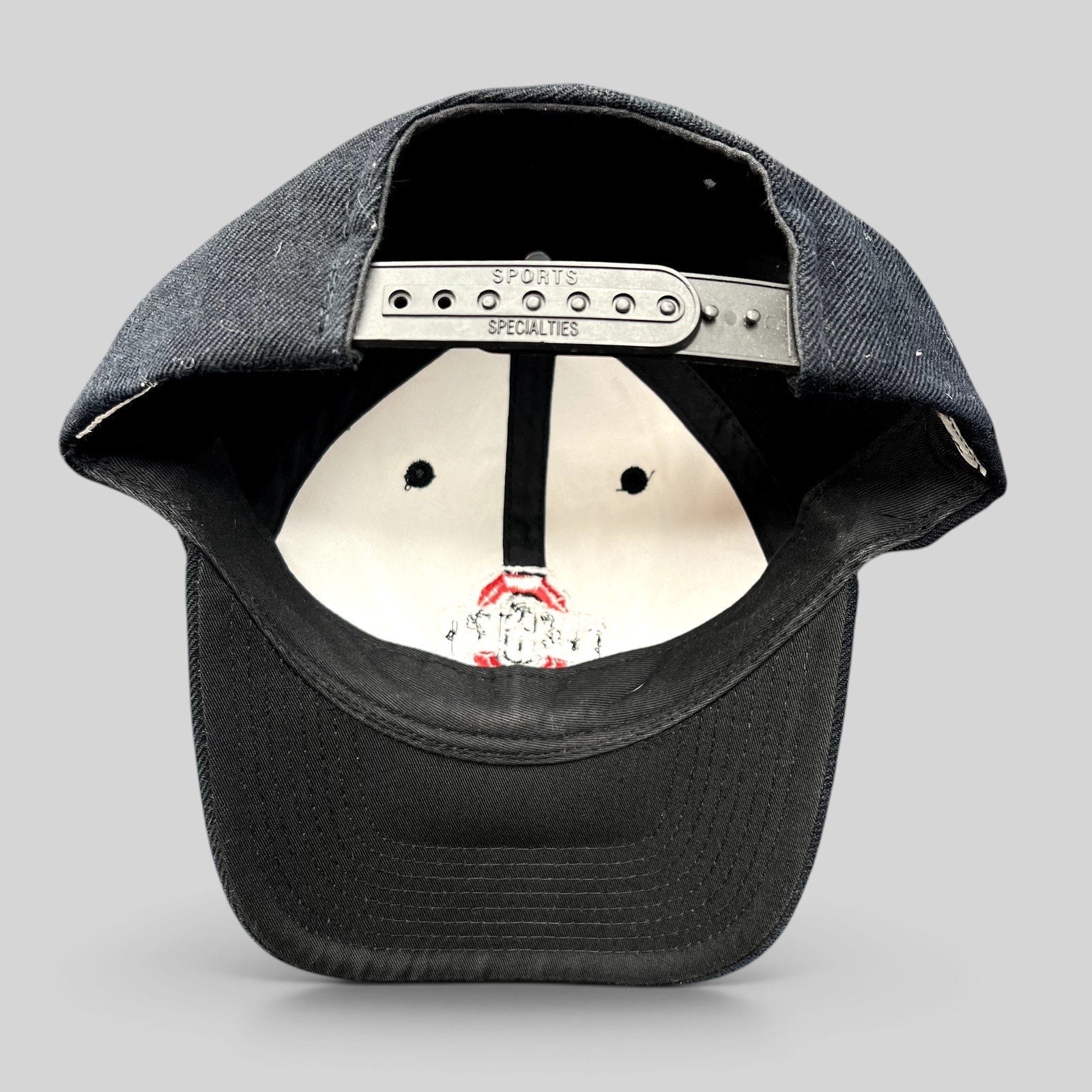 Raree Finds vintage Ohio State Buckeyes Sports Specialties snapback hat showing the black adjustable plastic strap