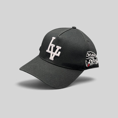 Raree Finds black Okami Brand strapback hat with white embroidered LV logo and side wolf-themed graphic artwork