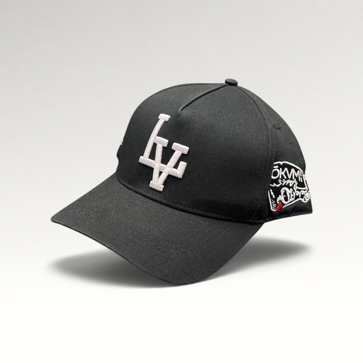 Raree Finds black Okami Brand strapback hat with white embroidered LV logo and side wolf-themed graphic artwork