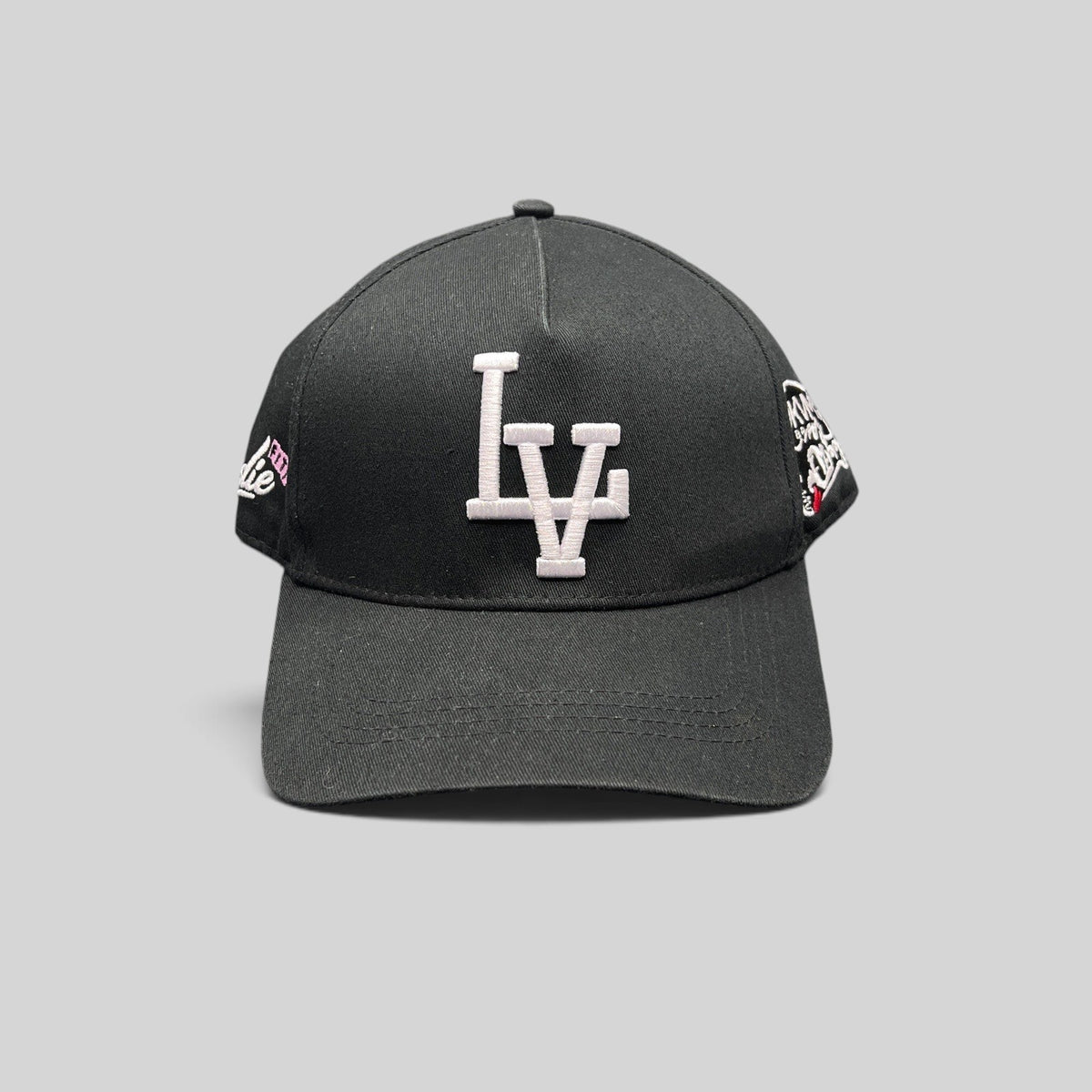 Raree Finds black Okami Brand strapback hat with white embroidered LV logo and detailed side panel artwork