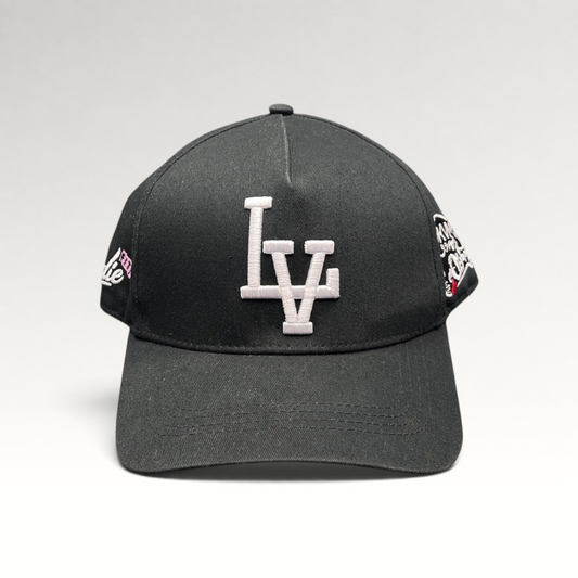 Raree Finds black Okami Brand strapback hat with white embroidered LV logo and detailed side panel artwork