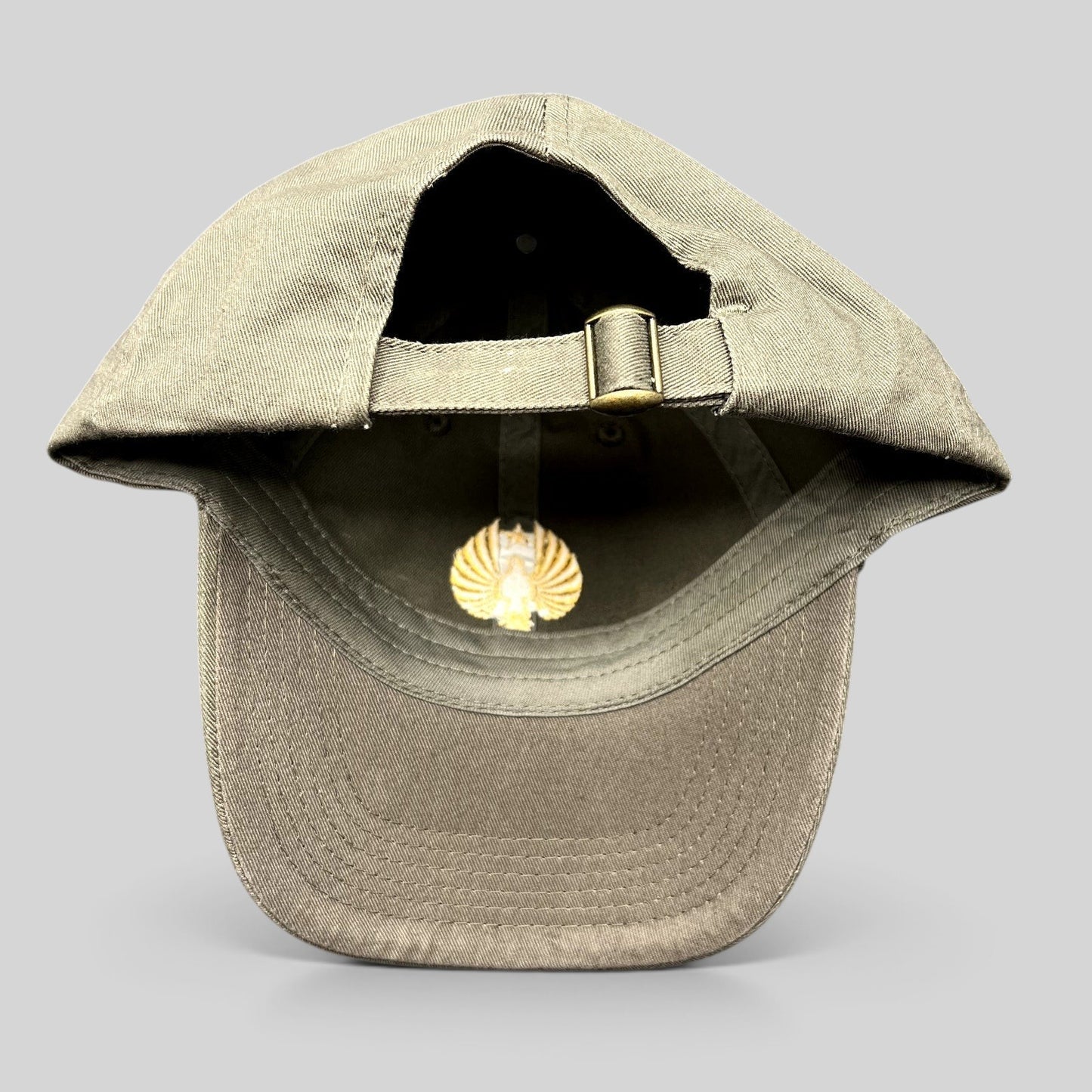 Raree Finds Pacific Rim Uprising olive cotton strapback hat with brass buckle and gold Jaeger Pilot interior detail