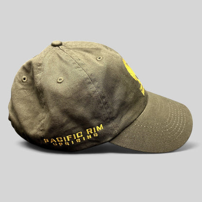 Raree Finds olive drab cotton strapback hat with gold Pacific Rim Uprising embroidery and military-inspired design.