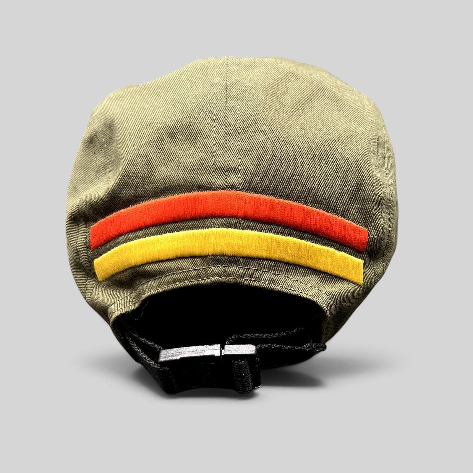 Raree Finds olive green 5-panel strapback hat with red and yellow rear stripes and adjustable black buckle closure.