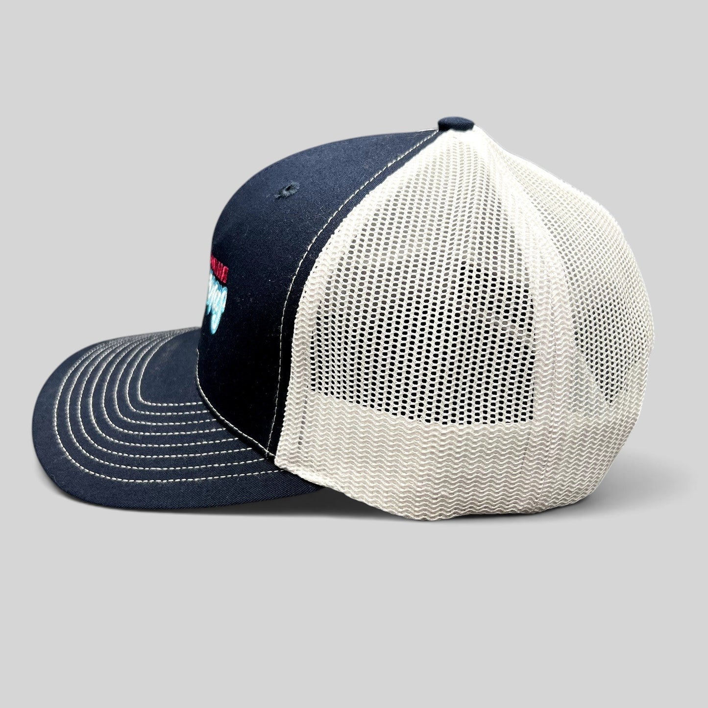 Raree Finds Omaha Supernovas Richardson 112 navy blue and white mesh trucker hat with embroidered logo side view