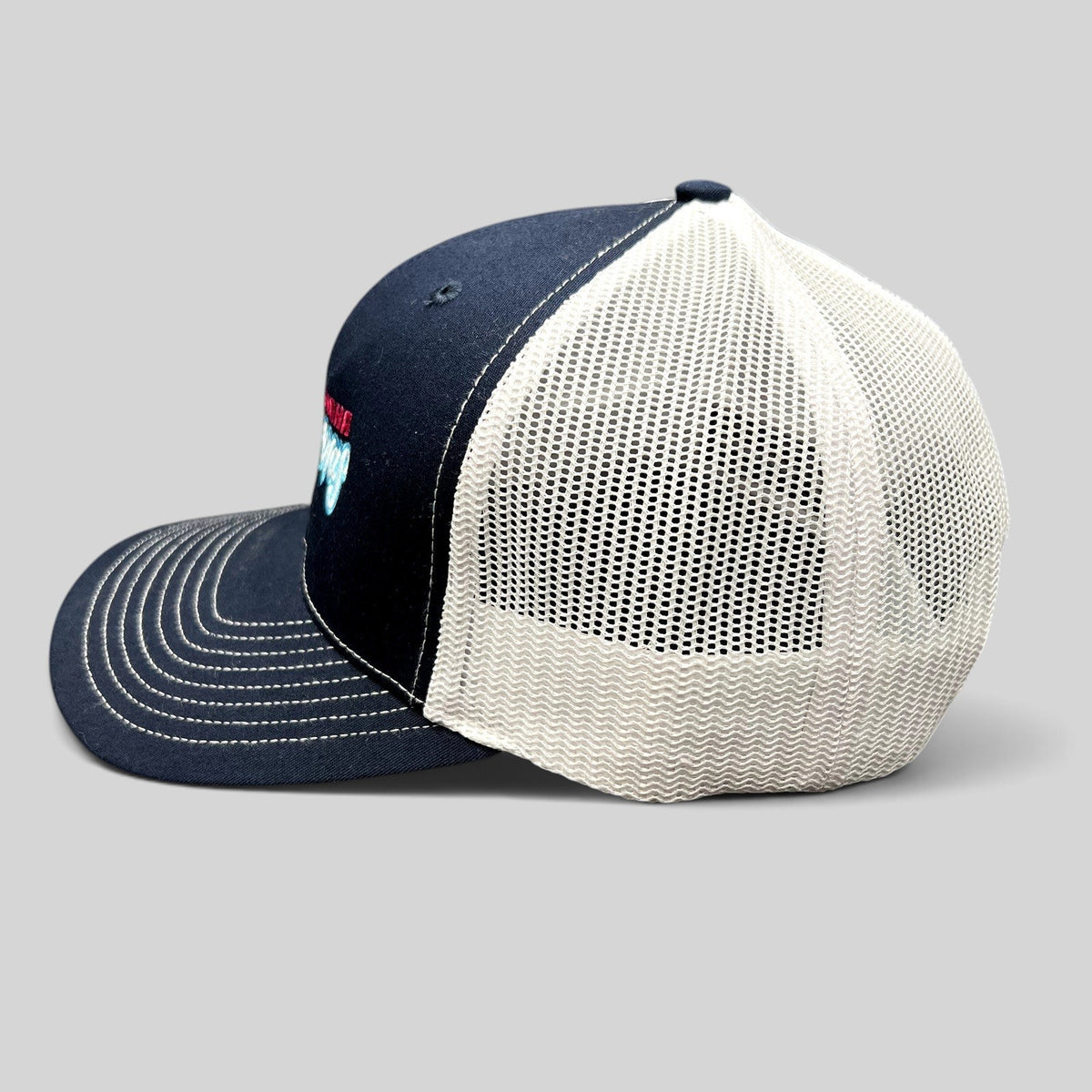 Raree Finds Omaha Supernovas Richardson 112 navy blue and white mesh trucker hat with embroidered logo side view
