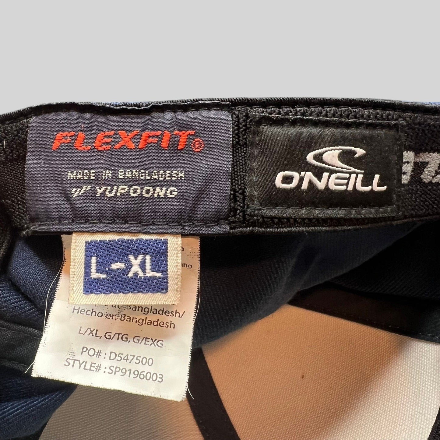 Raree Finds O’Neill Flexfit hat interior label showing size L/XL and Yupoong manufacturing details