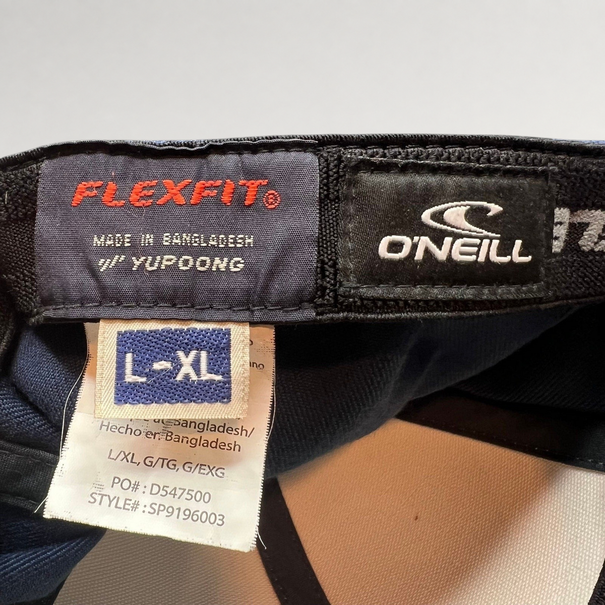 Raree Finds O’Neill Flexfit hat interior label showing size L/XL and Yupoong manufacturing details