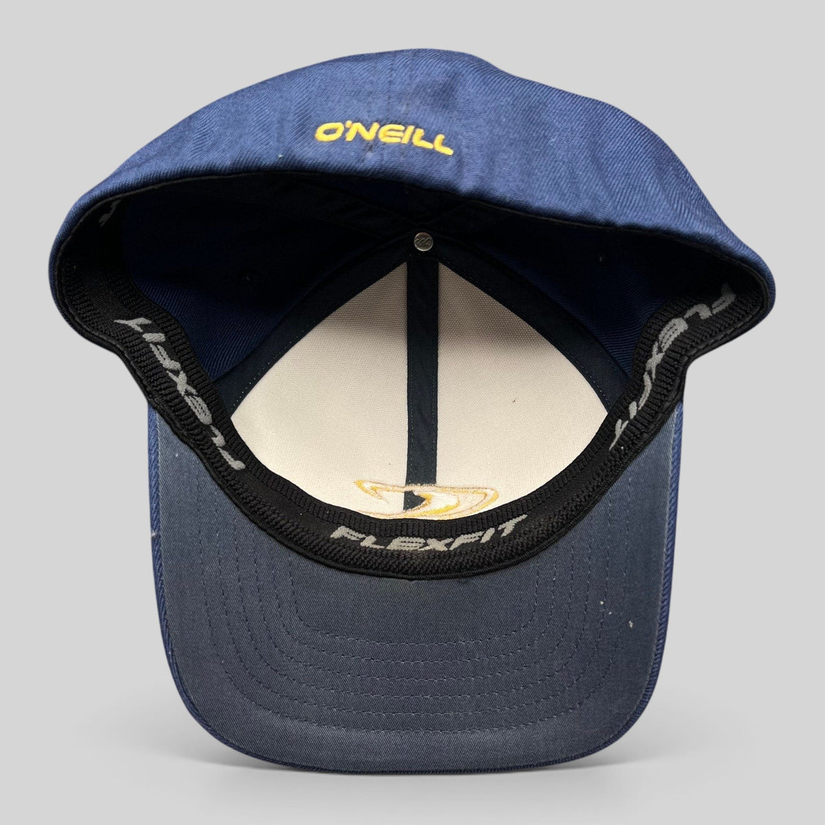 Raree Finds vintage O’Neill Flexfit surf cap showing the interior stretch band and navy blue construction.
