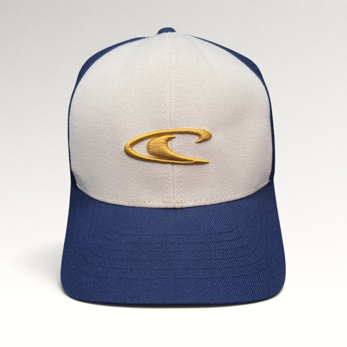 Raree Finds vintage O’Neill Flexfit surf cap with a white crown, navy bill, and gold embroidered wave logo.