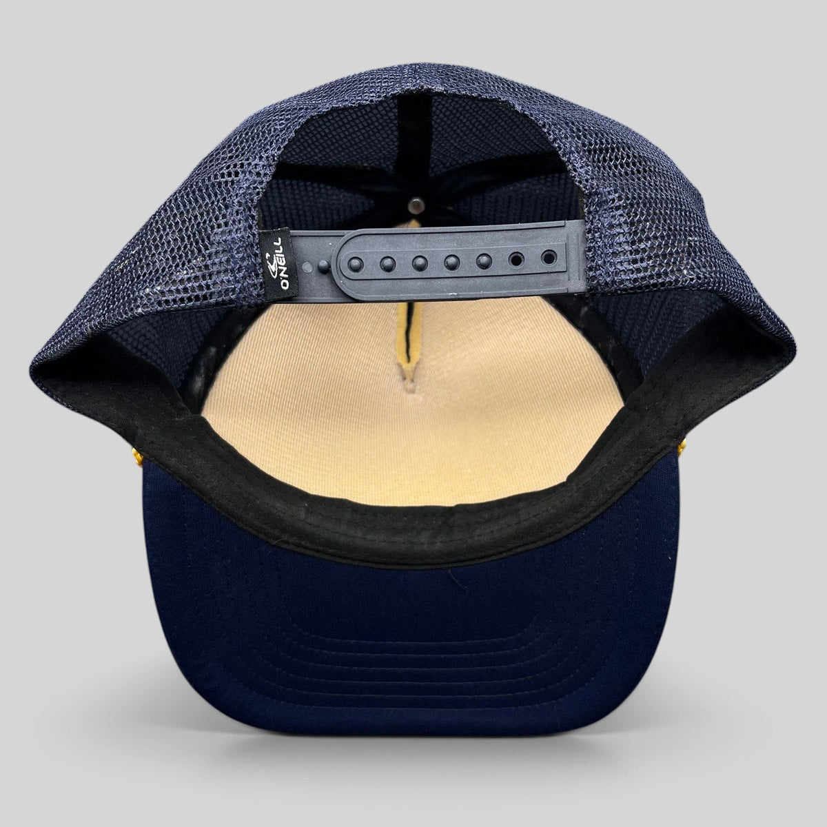 Raree Finds O’Neill navy and yellow trucker hat with adjustable snapback closure and breathable mesh back panel