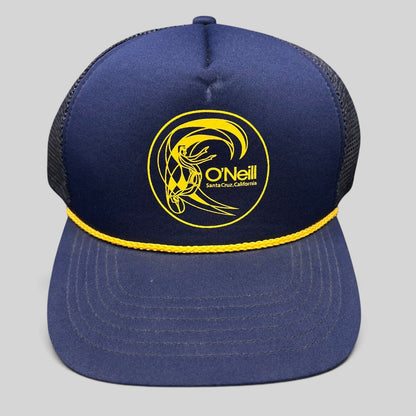 Raree Finds vintage O’Neill navy trucker hat with yellow surfer graphic, rope detail, and mesh back.