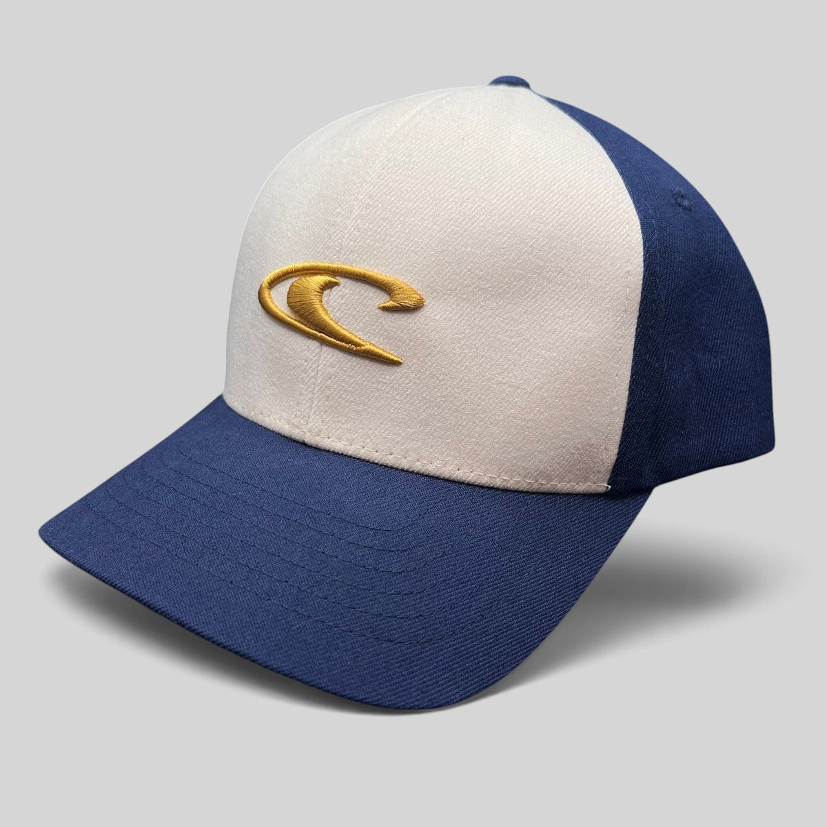 Raree Finds vintage O’Neill Flexfit surf hat with a white crown, navy bill, and gold embroidered wave logo.