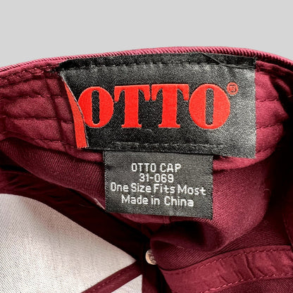 Raree Finds burgundy Otto Cap interior tag showing brand logo and style number 31-069 inside the snapback hat