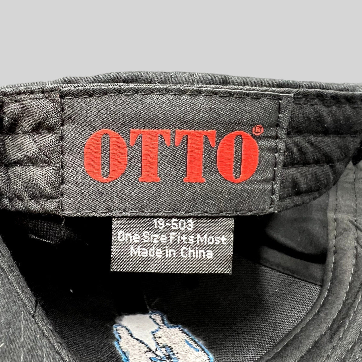 Raree Finds black OTTO cap interior label with red branding and size information for U2 tour merchandise