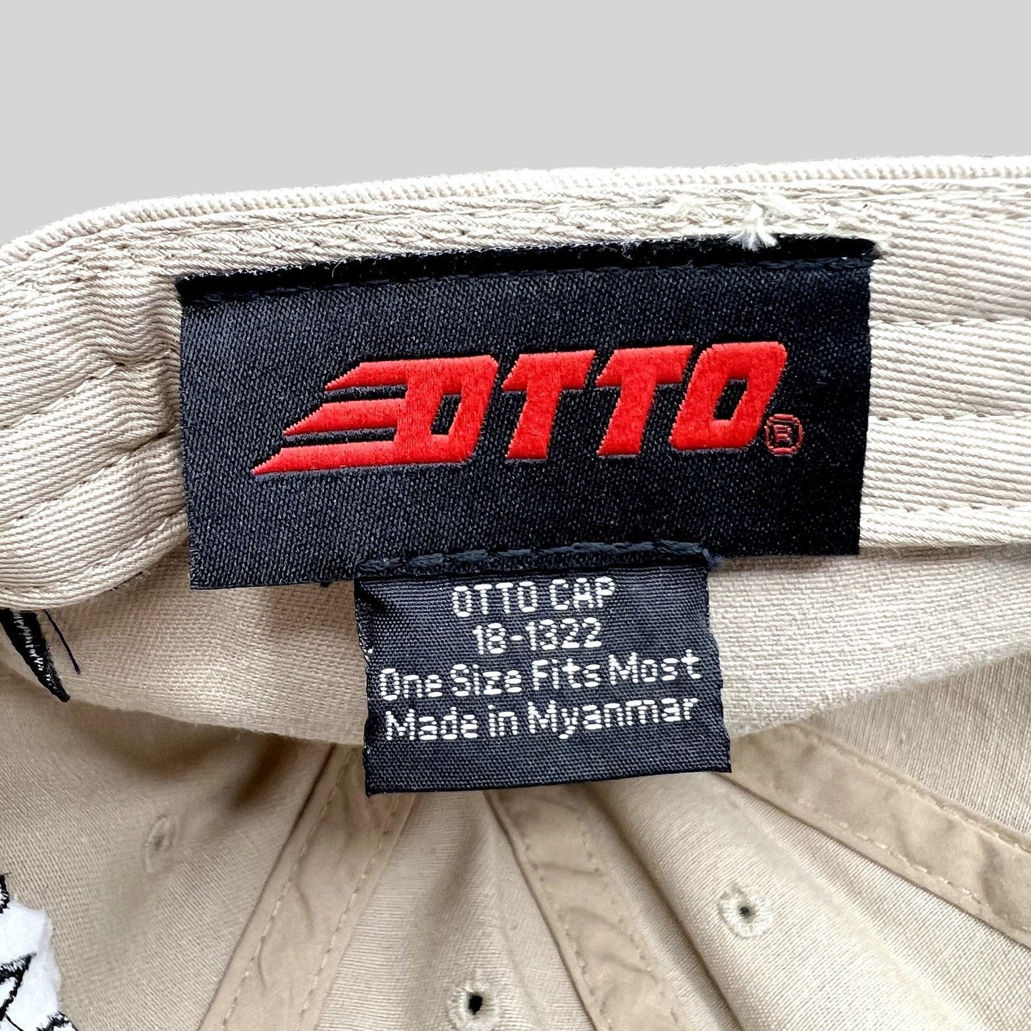 Raree Finds OTTO Cap interior tag showing brand logo and manufacturing details on a beige cotton twill hat