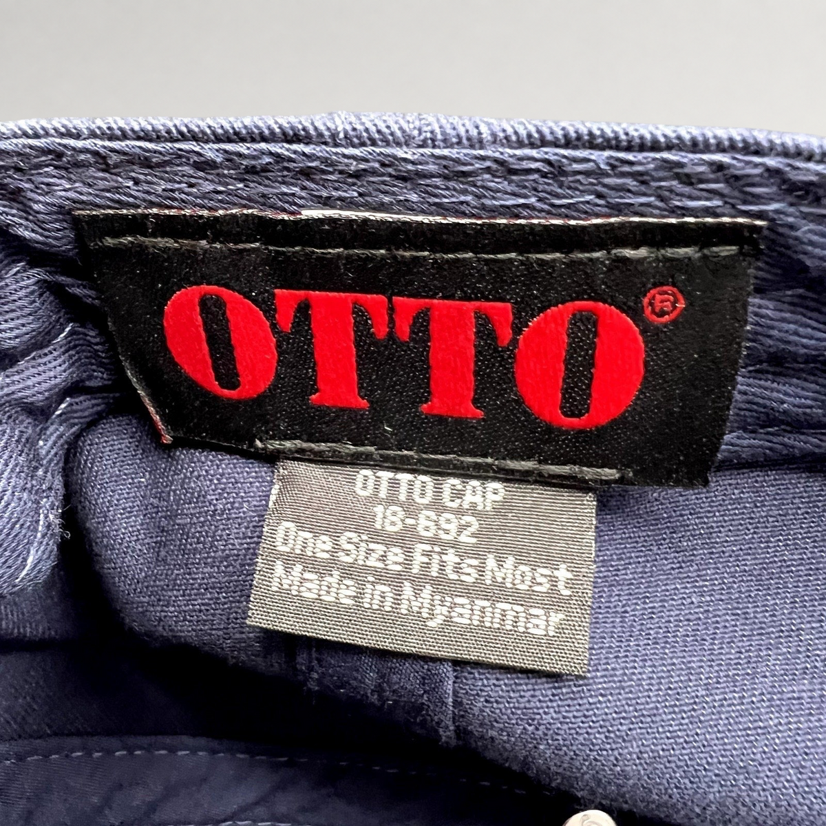 Raree Finds navy cotton twill dad hat interior showing the Otto Cap brand label and size tag