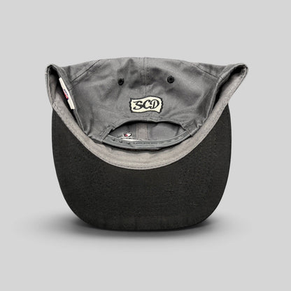 Raree Finds vintage Otto Cap snapback showing the SCD embroidered patch on the gray cotton twill back panel