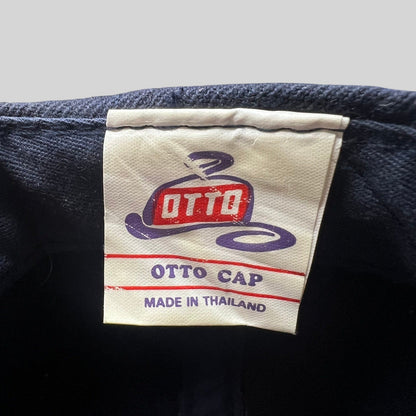 Raree Finds vintage OTTO Cap interior tag with logo and Made in Thailand text on a navy snapback hat