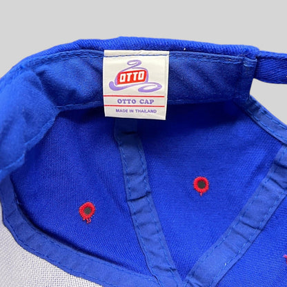 Raree Finds vintage 90s Otto Cap snapback hat interior label showing royal blue fabric and red ventilation eyelets