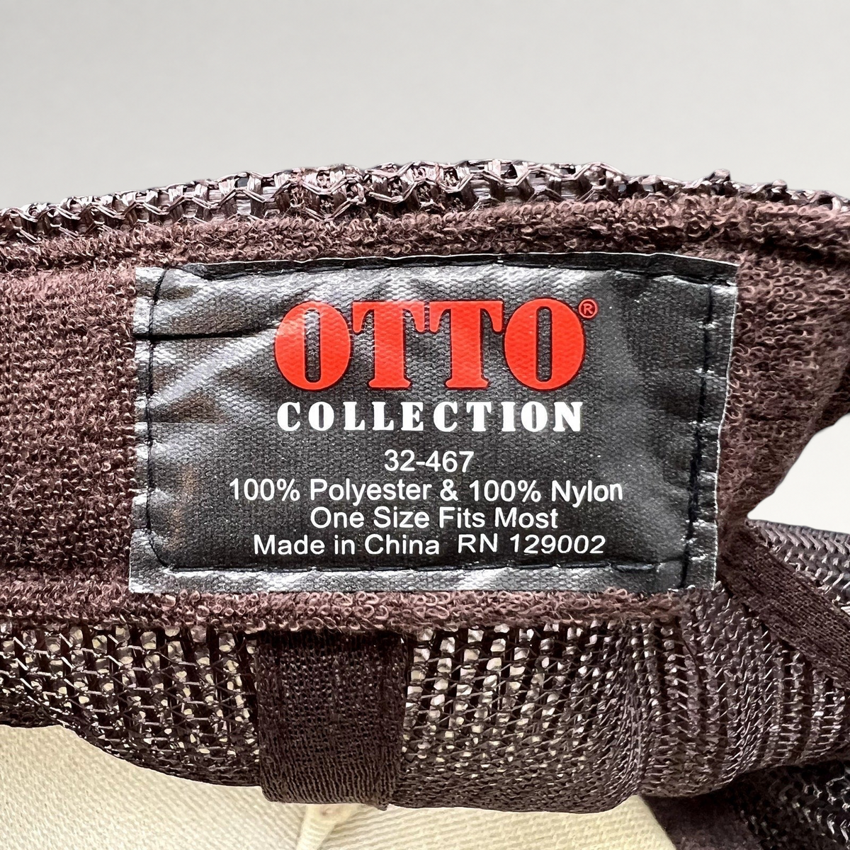 Raree Finds OTTO Collection brown polyester and nylon trucker hat interior care label