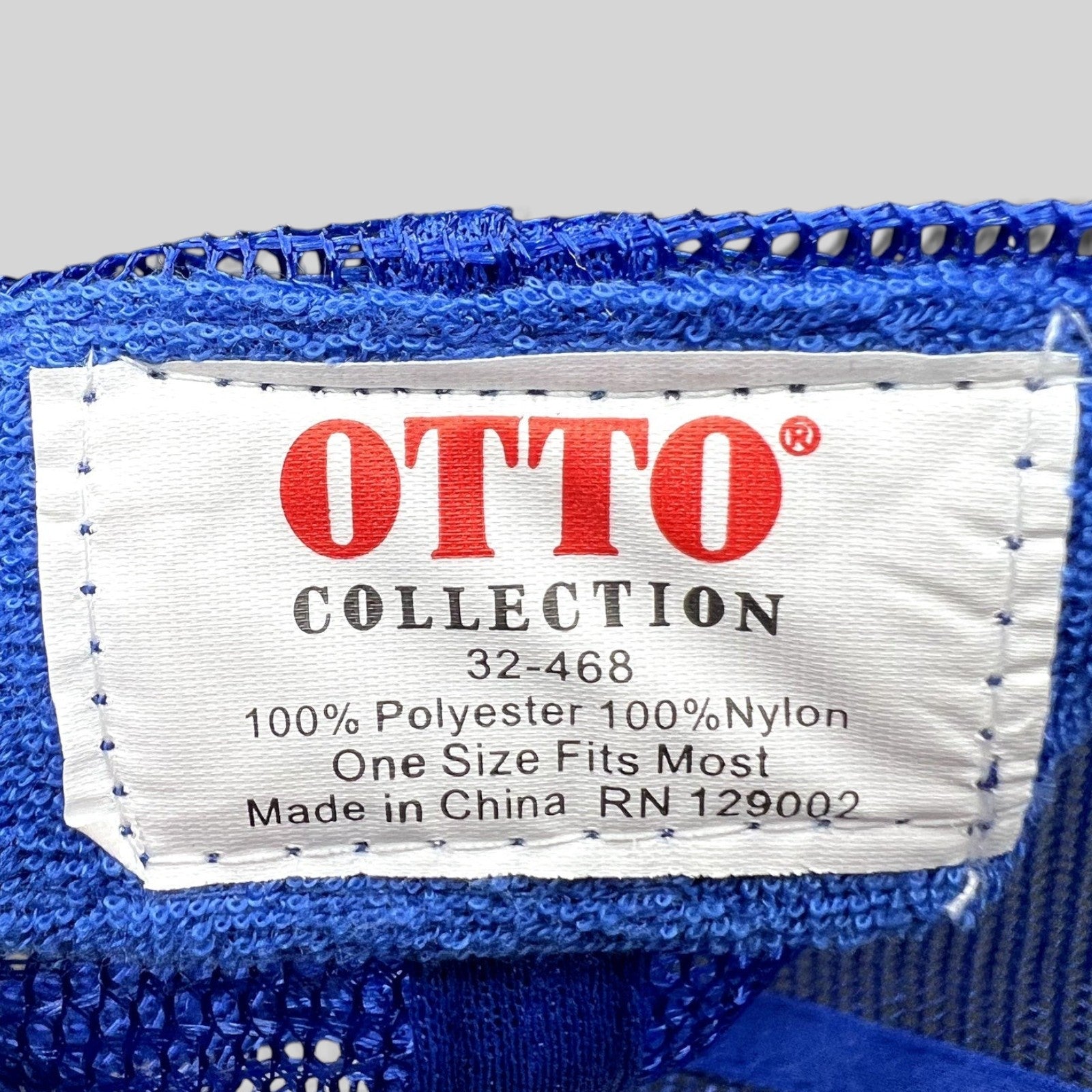 Raree Finds OTTO Collection trucker hat interior tag showing polyester and nylon material composition