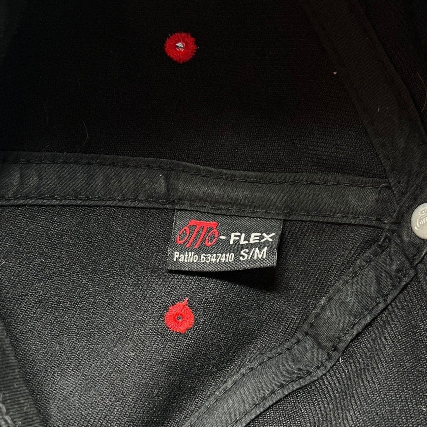 Raree Finds vintage Otto Flex hat interior tag showing size S/M and black fabric construction with red eyelets.