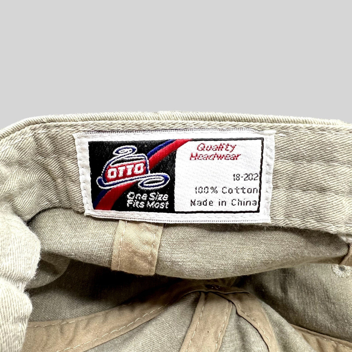 Raree Finds vintage OTTO cotton hat interior label showing brand logo, material composition, and origin details