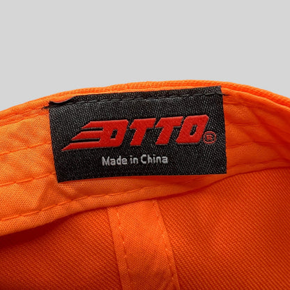 Raree Finds Otto brand label inside a blaze orange snapback hat showing Made in China text