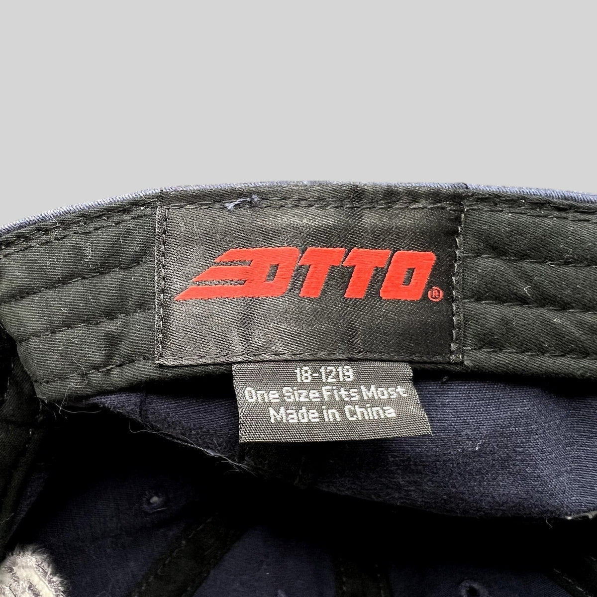 Raree Finds vintage Otto navy blue hat interior label with brand logo and size information