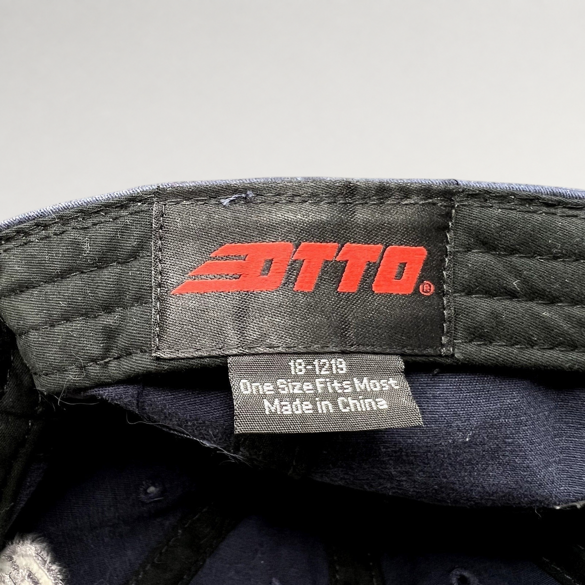 Raree Finds vintage Otto navy blue hat interior label with brand logo and size information