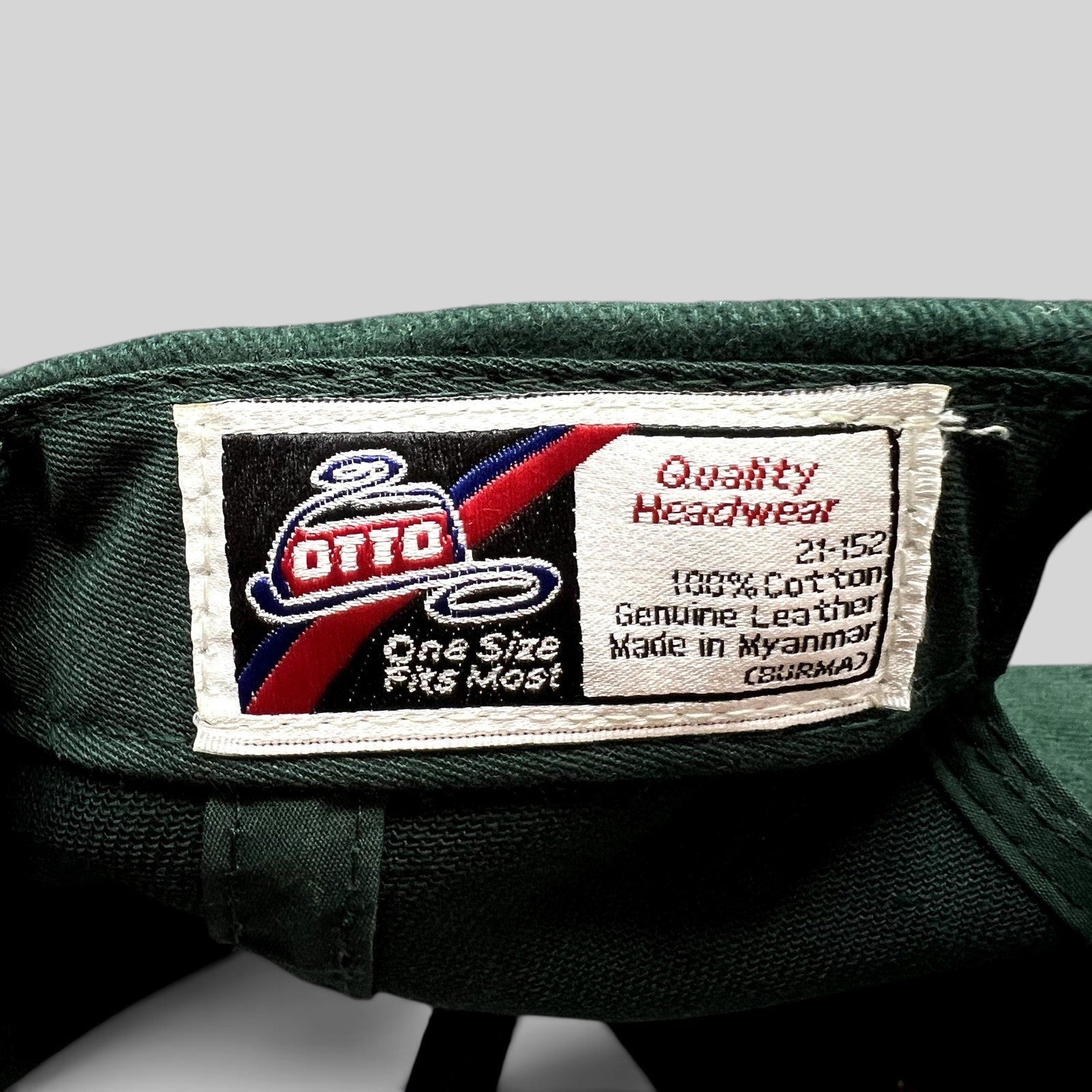 Raree Finds vintage OTTO Headwear label inside a forest green cotton golf hat with leather strap details